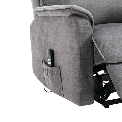 Close-up of a Salford Grey Lift & Tilt Recliner (Dual Motor) showing the side pocket holding a black remote control, with part of the reclining footrest and black support frame visible against a white background.