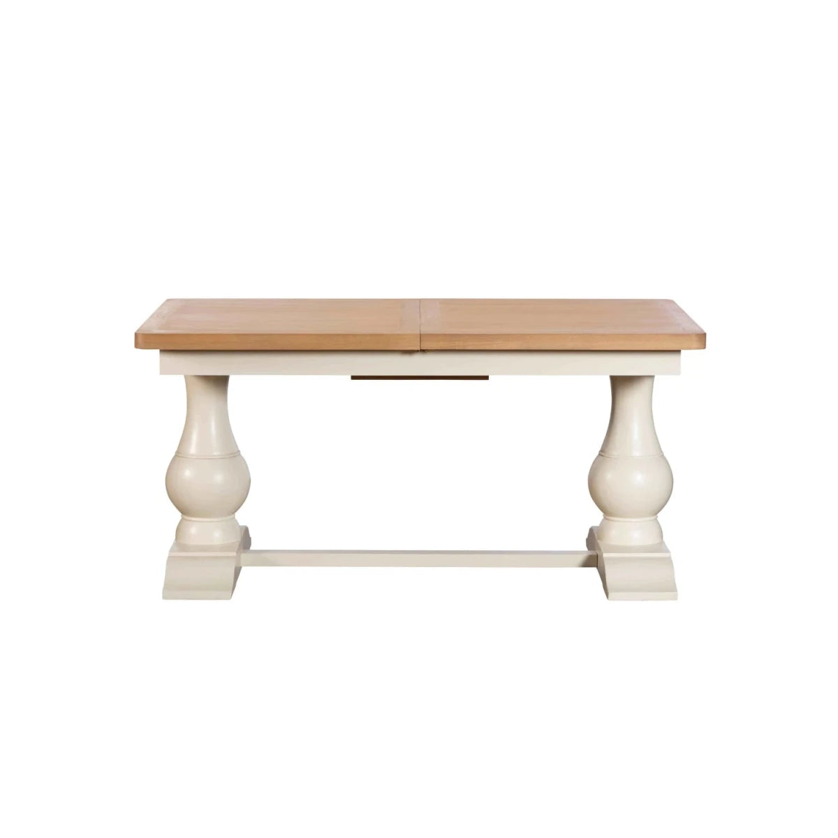 Oak extending dining table with turned pedestal legs