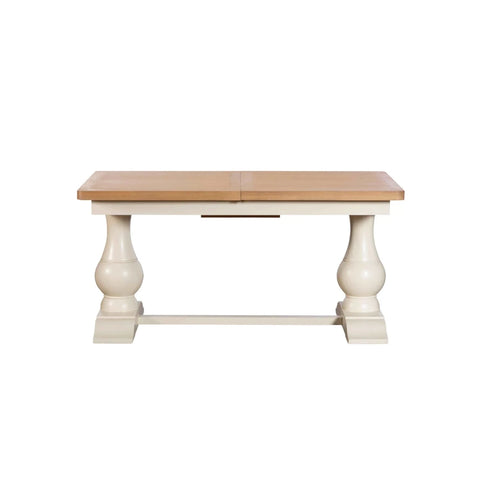Oak extending dining table with turned pedestal legs
