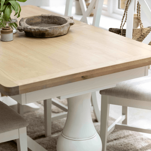 Closeup of Salford oak and white dining table with double pedestal base
