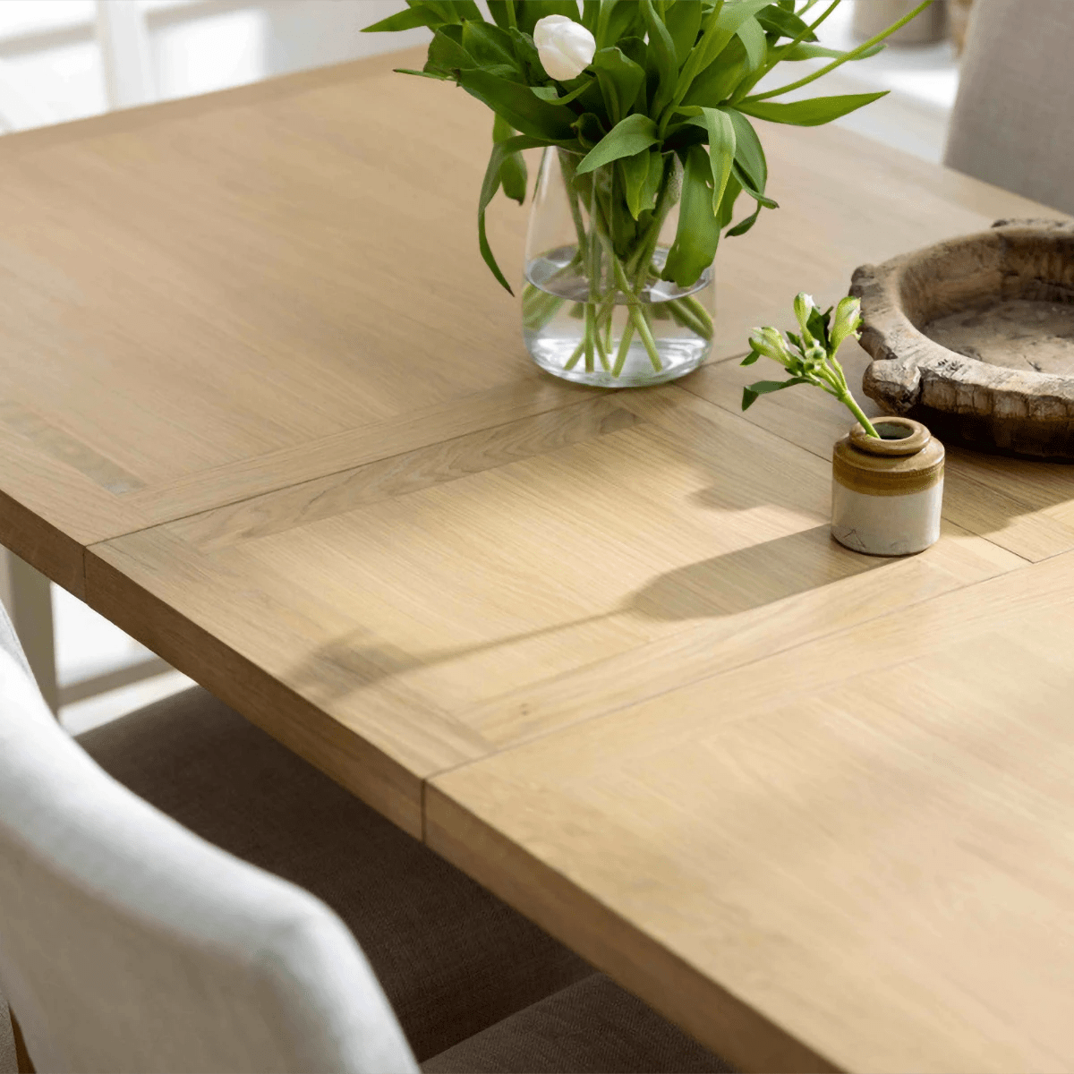 Top Close up of Salford oak and white dining table with double pedestal base
