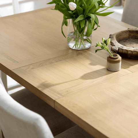 Top Close up of Salford oak and white dining table with double pedestal base