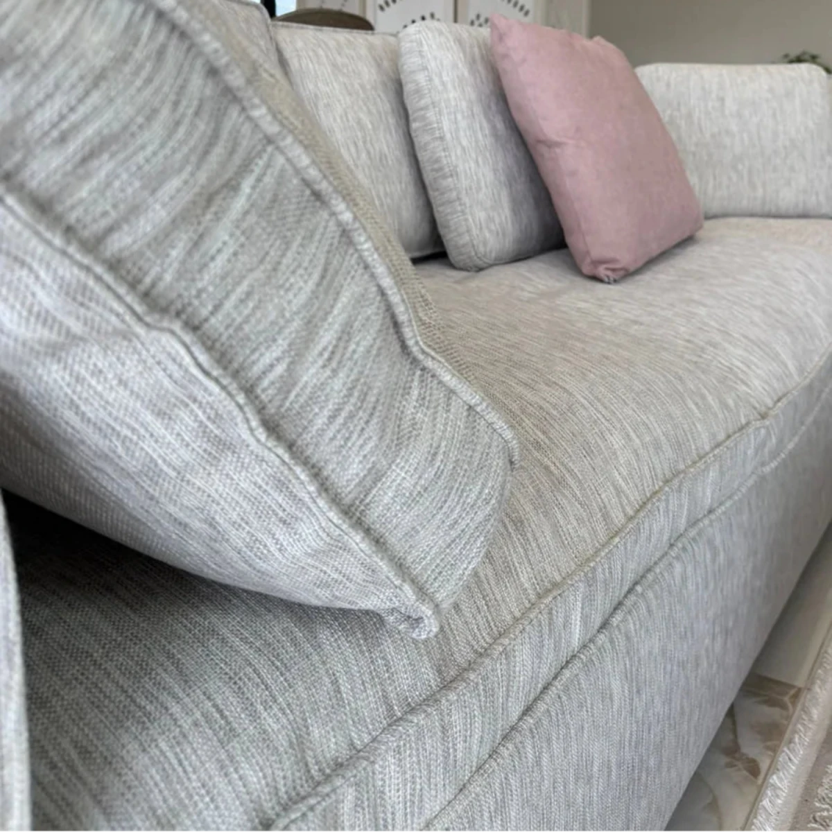 Linen weave fabric corner sofa with soft breathable texture.