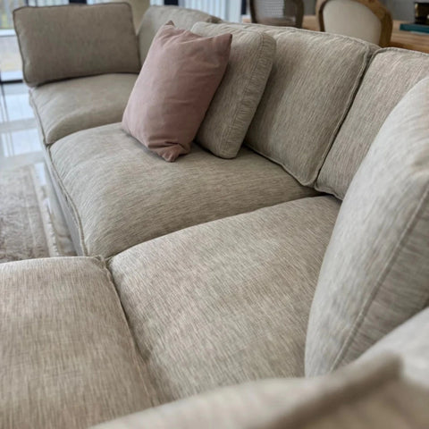 Comfort-focused sofa with premium cushion filling.