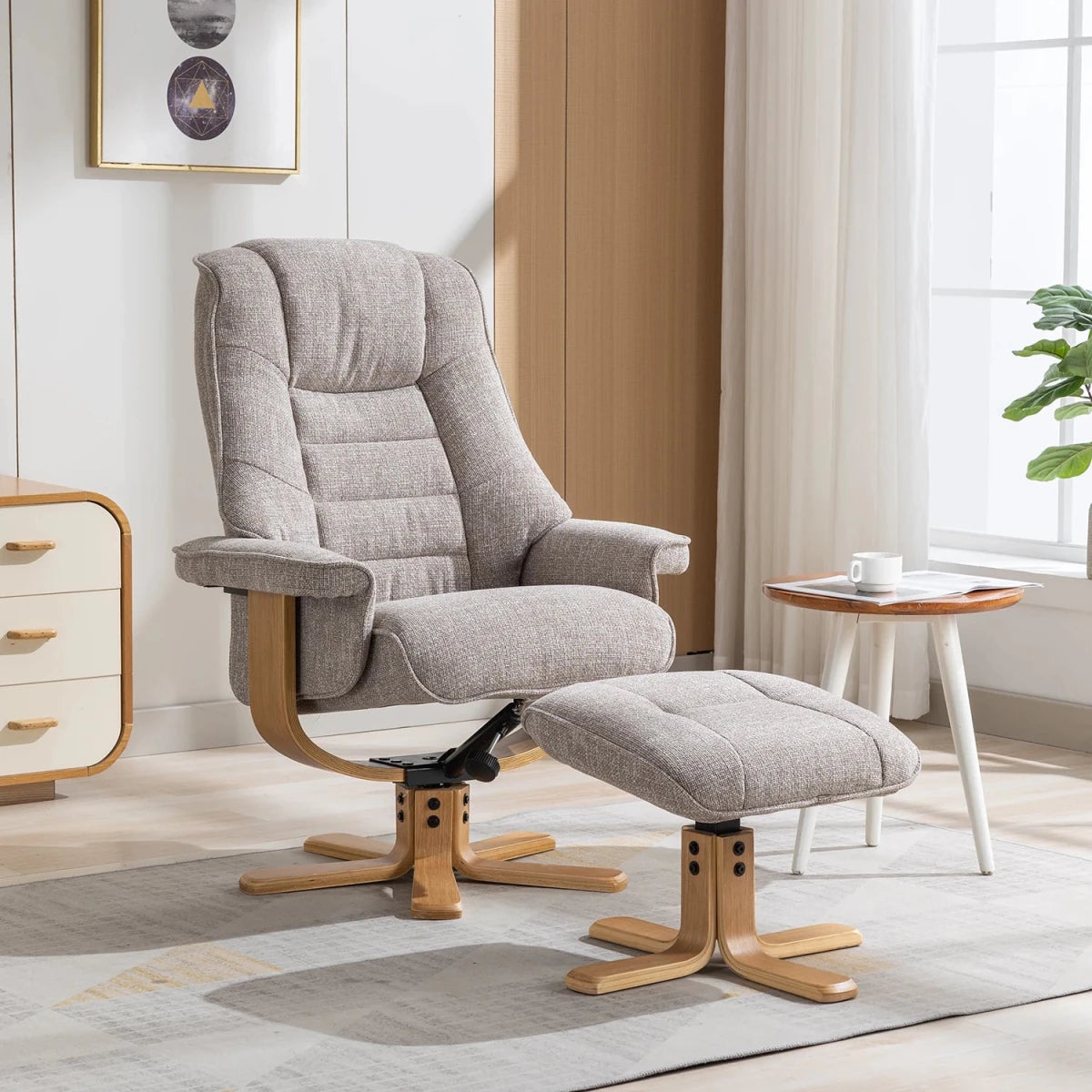 A Oat meal upholstered recliner chair with a matching ottoman, both with natural wood bases, shown in a bright, modern living room setting.