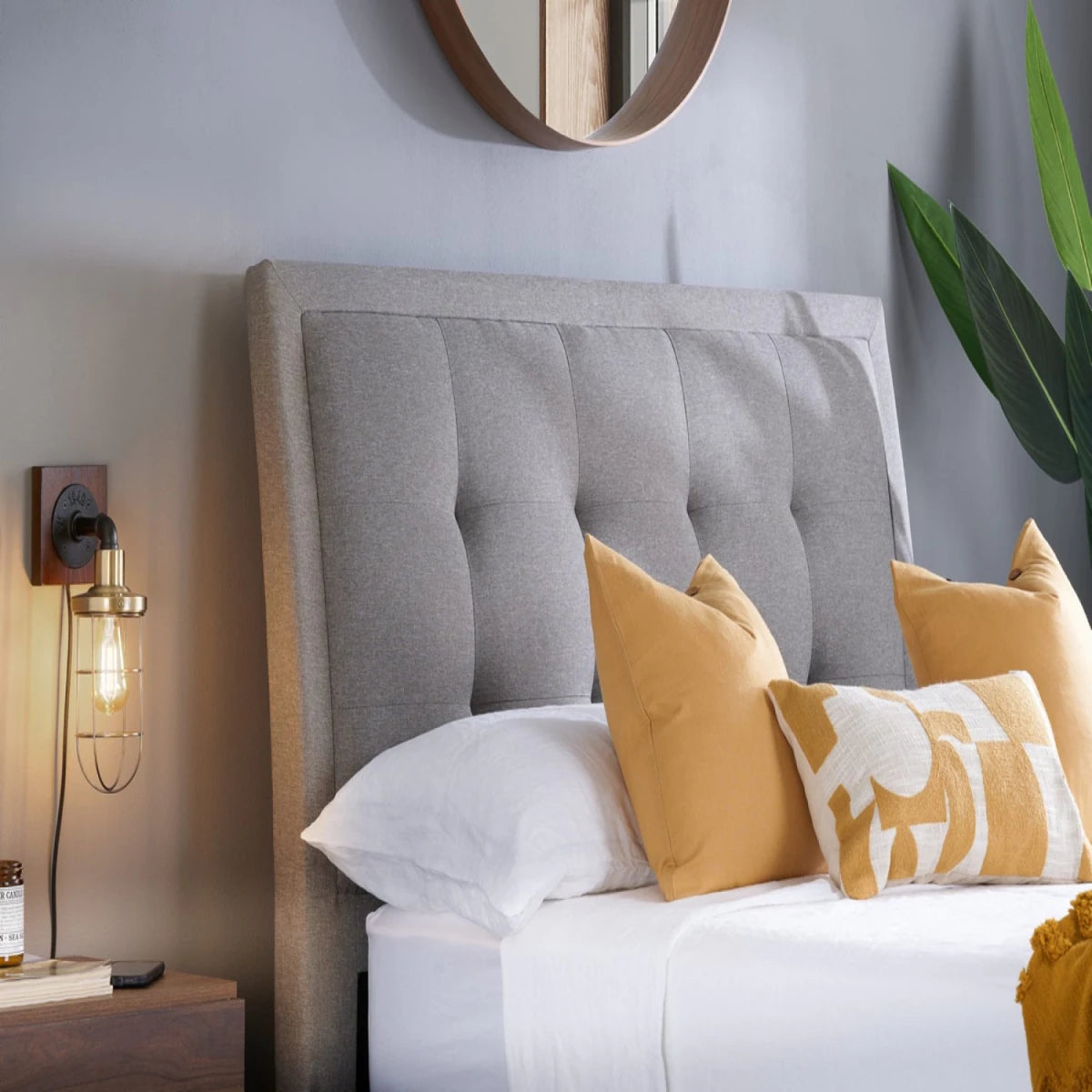 Deep buttoned headboard with elegant tufted detailing.