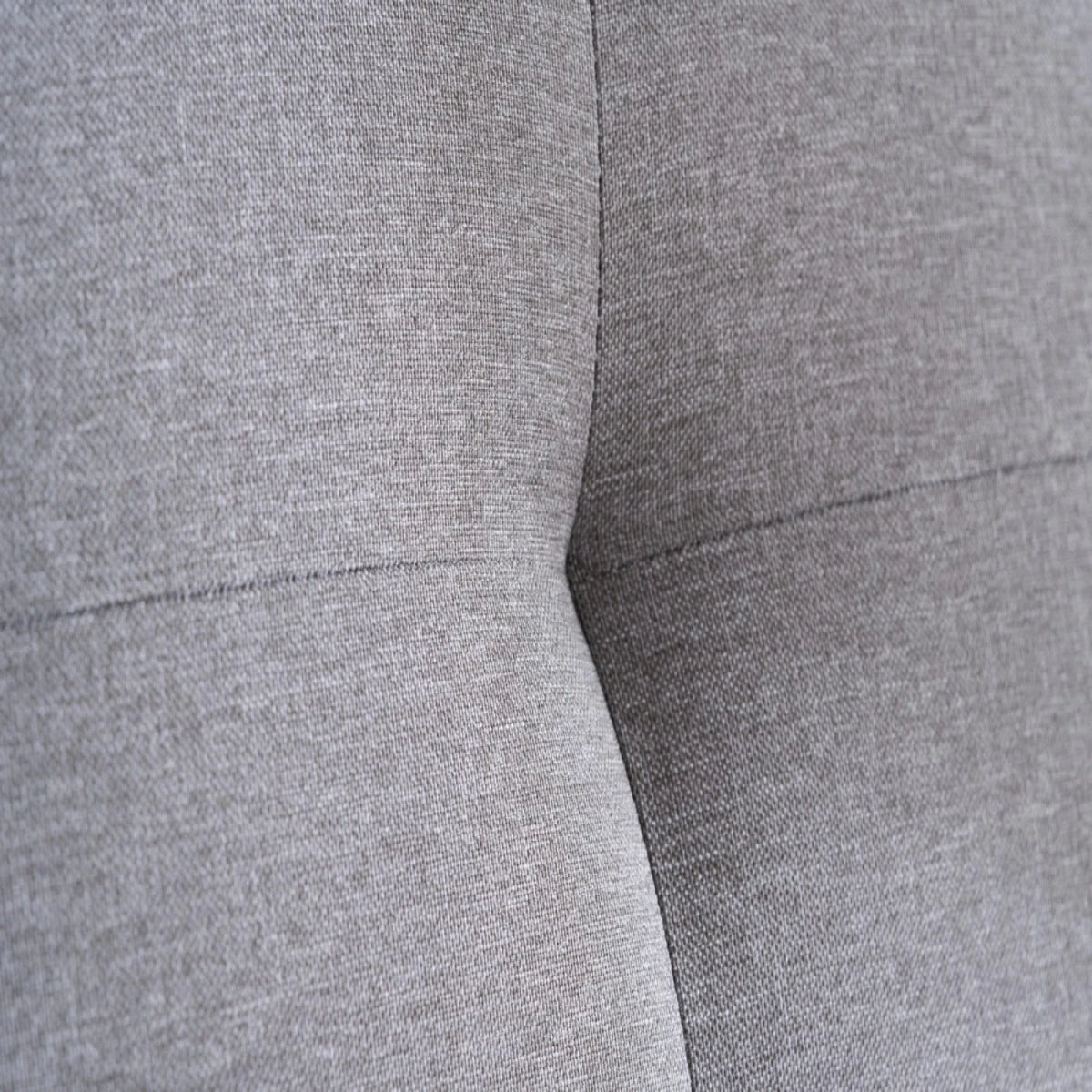 Soft grey fabric upholstery with smooth texture.