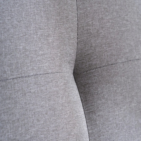 Soft grey fabric upholstery with smooth texture.