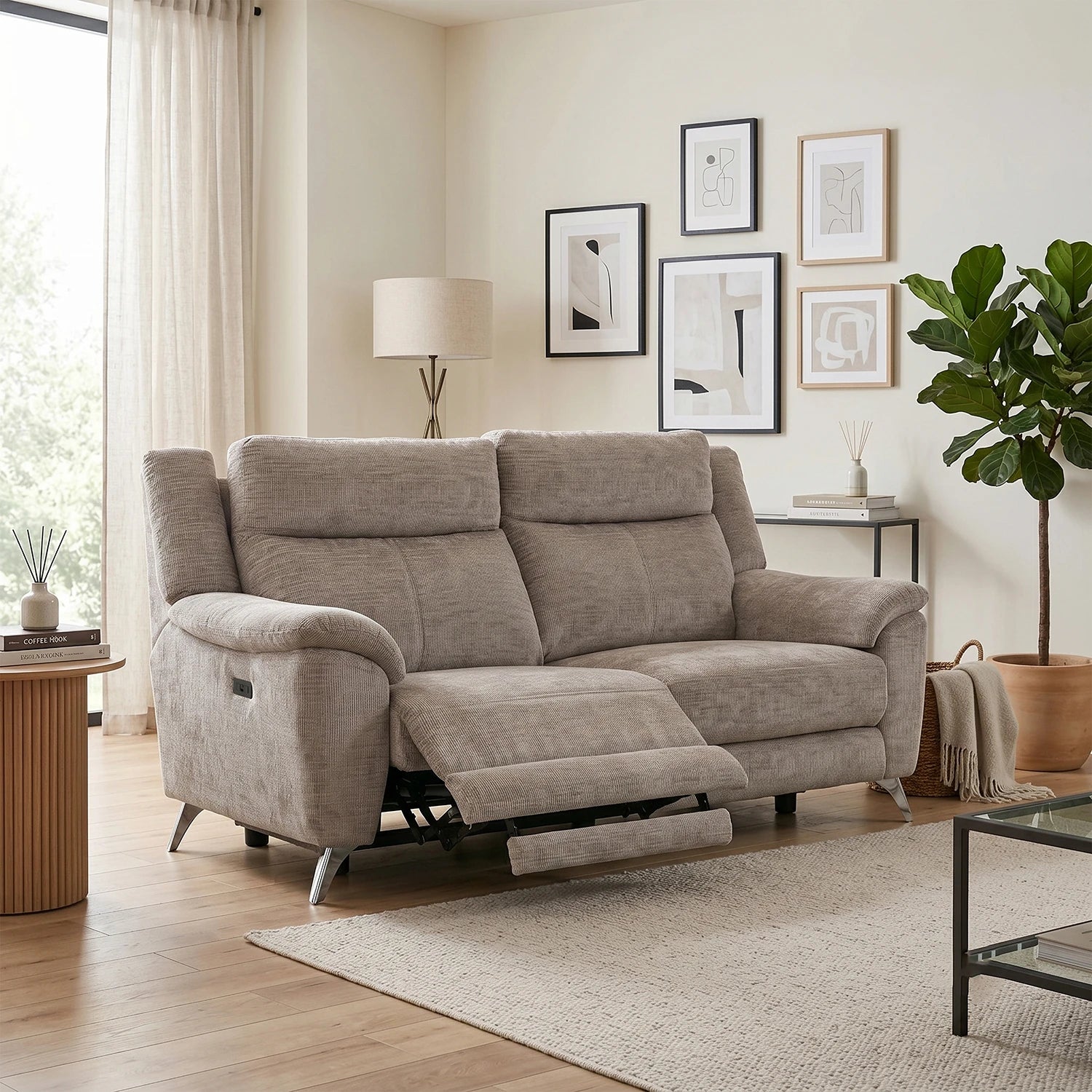 A beige upholstered reclining 3 Seater Sofa 