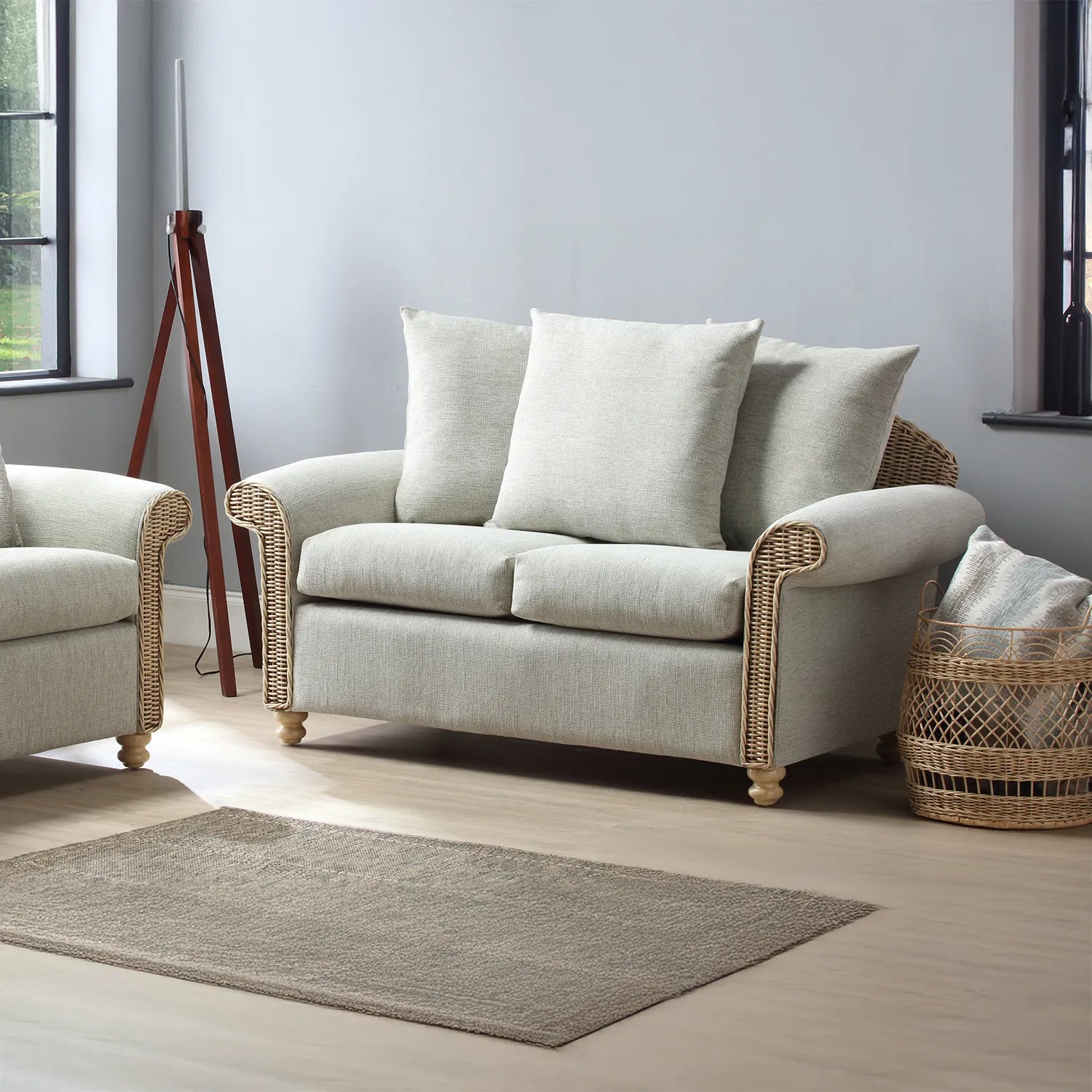 Desser Samford Rattan 2 Seater Sofa with Scatter Cushions in Pebble Fabric, available in a 3 Seater, 2 Seater, Swivel Rocker, Swivel Chair, Armchair and Footstool.  Choose from various fabrics - Lifestyle Image of 2 seater with Scatter Cushions 