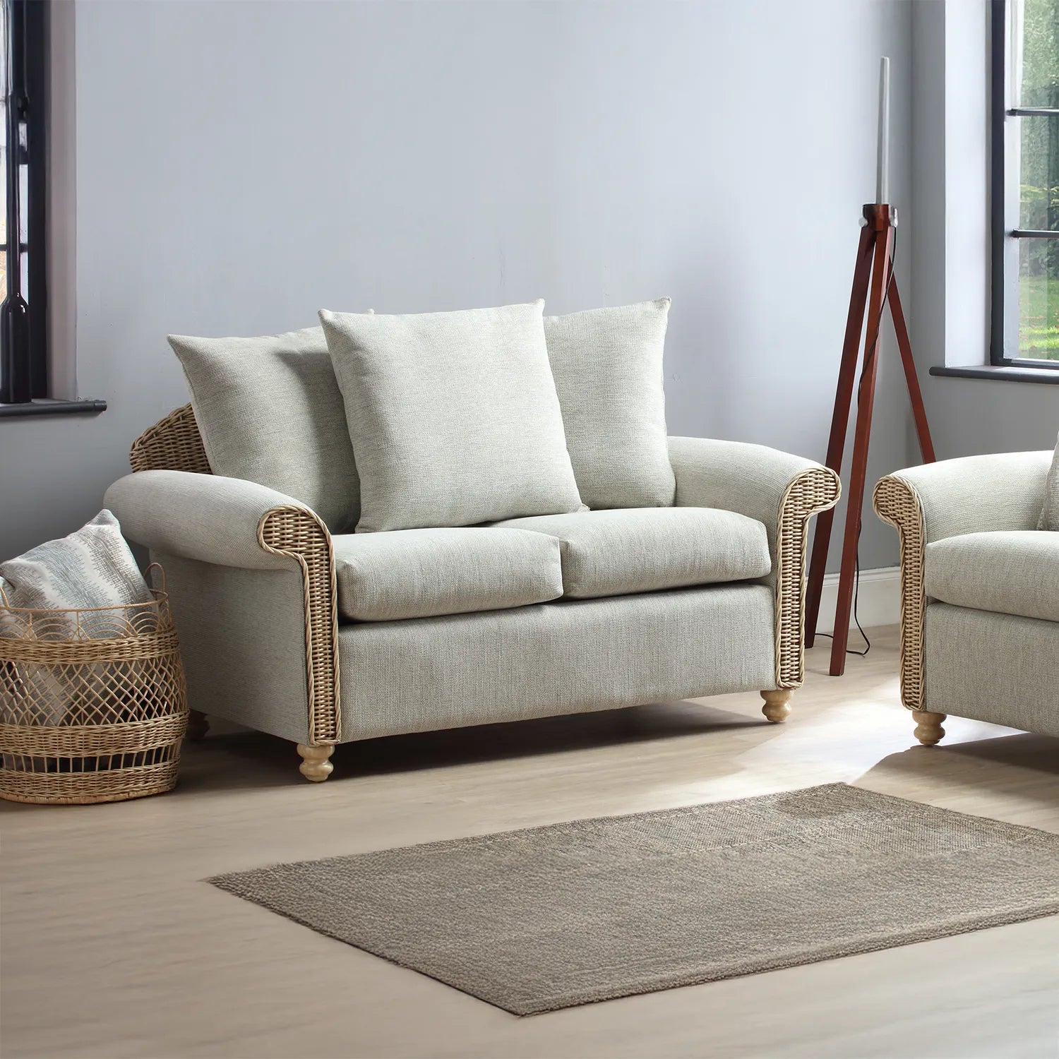Desser Samford Rattan 2 Seater Sofa with Scatter Cushions in Pebble Fabric, available in a 3 Seater, 2 Seater, Swivel Rocker, Swivel Chair, Armchair and Footstool.  Choose from various fabrics - 2 Seater Lifestyle Image 
