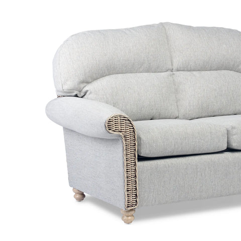 Desser Samford Rattan 3 Seater Sofa in Pebble Fabric. Also available in 2 Seater, Swivel Chair, Swivel Rocker, Armchair and Footstool. Style with matching Coffee Table and Lamp Table. Choose from a variety of fabrics - Close up of Arm wicker detail