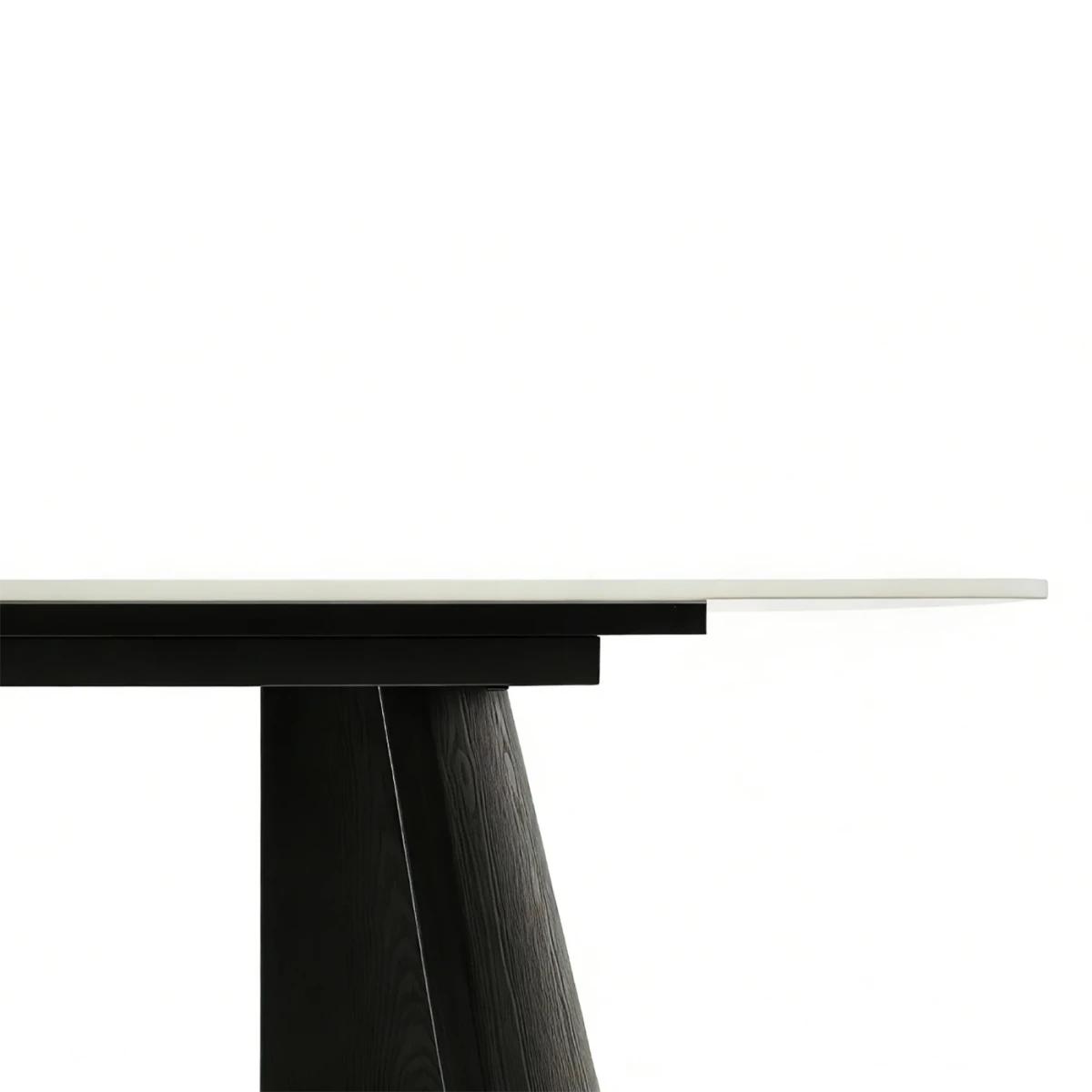 Close-up of a modern dining table with a Grey top and black base.