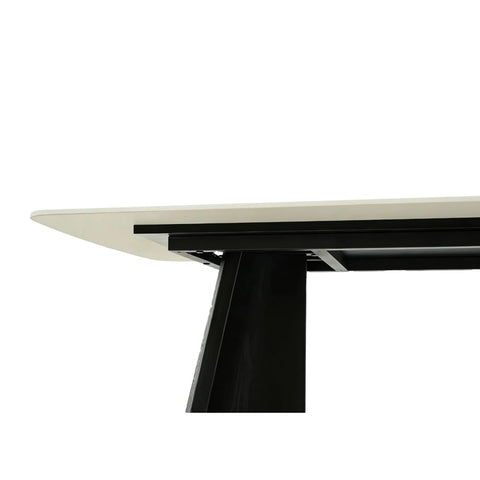 Close-up of a modern dining table with a Grey top and black metal legs on a white background