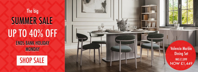 Dining room with a table and chairs, featuring a summer sale advertisement on the left.