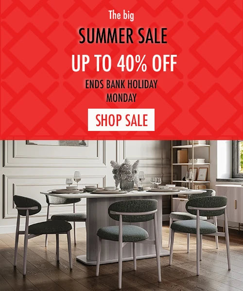 Dining room with a table and chairs, featuring a summer sale advertisement on a red patterned background.