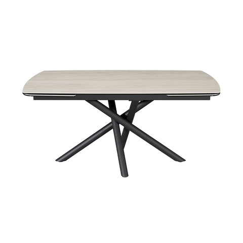 A modern rectangular dining table with a Travertine Ceramic top and a black metal X-shaped pedestal base, shown on a solid white background.