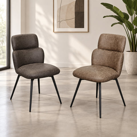 Two upholstered dining chairs with curved backs and black metal legs, shown on a plain white background.