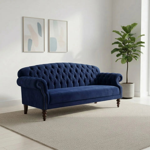 Refined sofa with curved arms and button detailing.