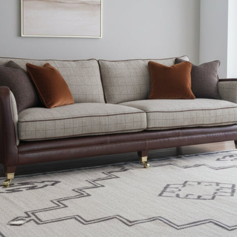 Premium fabric sofa with soft and refined finish.