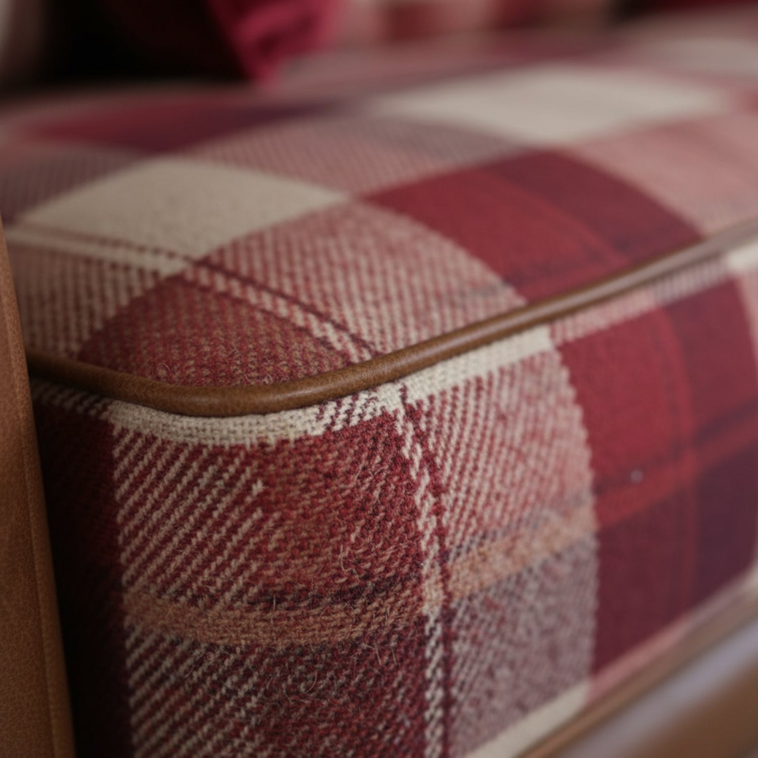 Fabric sofa with optional leather trim detailing.