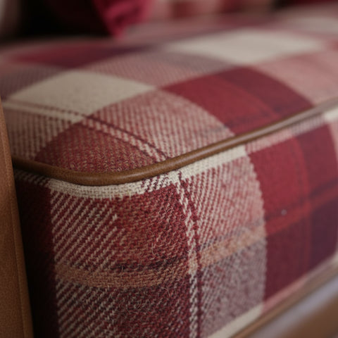 Fabric sofa with optional leather trim detailing.