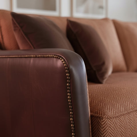 Classic sofa arms with decorative finial detailing.