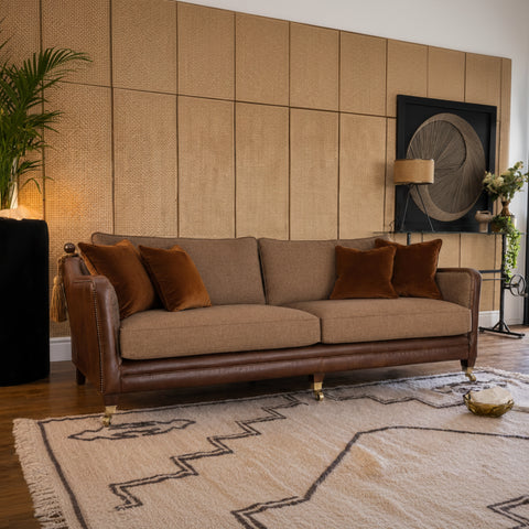 Compact fabric sofa ideal for cosy living spaces.