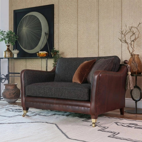 Comfortable snuggler with classic fabric upholstery.
