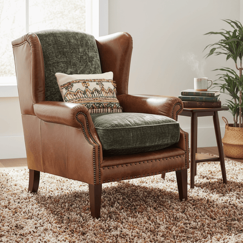 Tetrad Constable wing chair in  Brown leather armchair with green cushion and patterned pillow