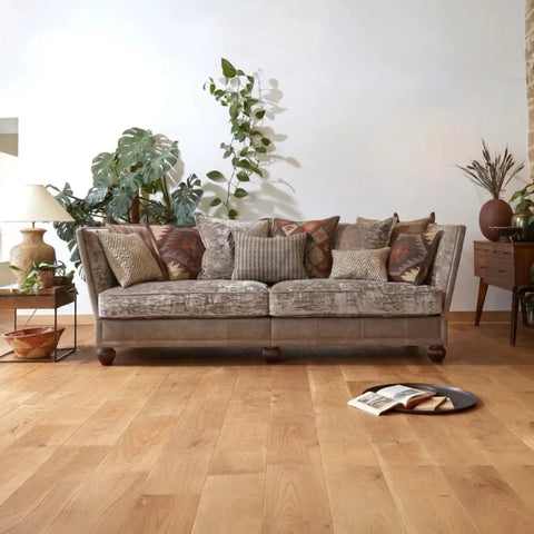 Knole style sofa with dropped arms and deep cushioned seating.