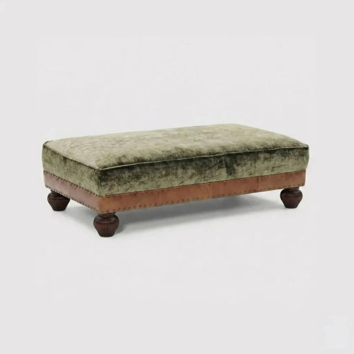 Velvet upholstered stool with leather border detailing.