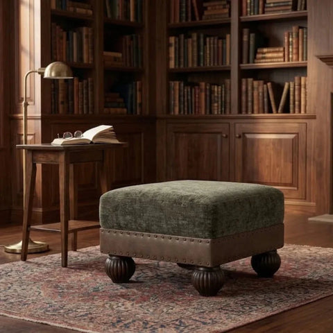 Velvet upholstered stool with soft leather border trim.