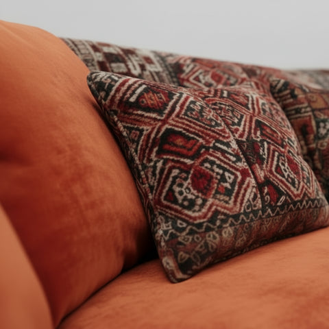 Feather filled seat cushions providing sink-in comfort.
