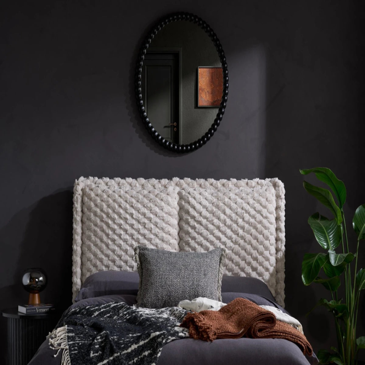 Deep tufted headboard with ultra-soft furry finish.