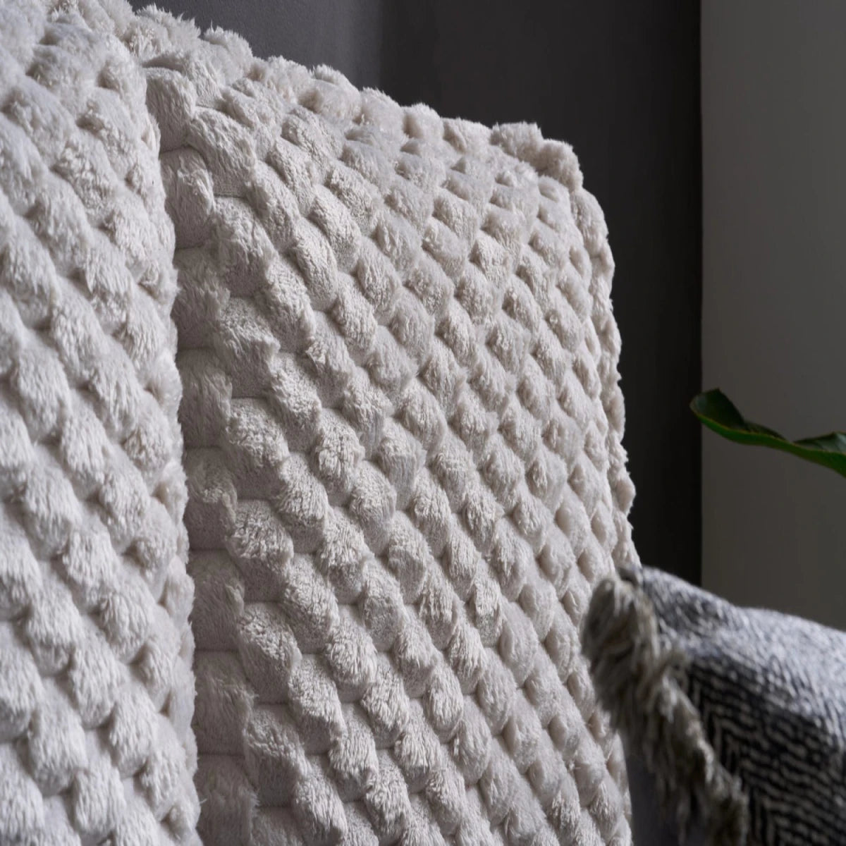 Elegant padded headboard with rich textured upholstery.