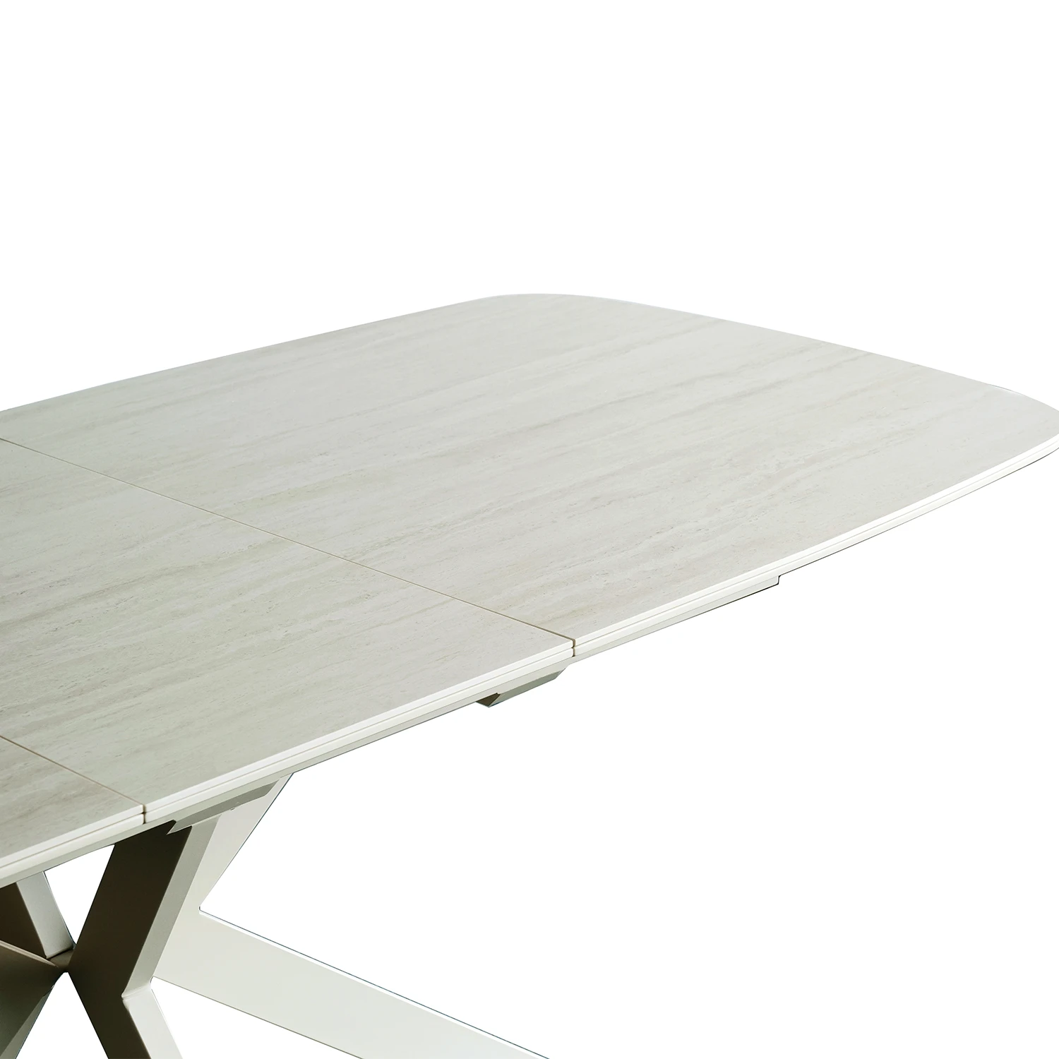 A close-up of a Large Travertine extending dining table with a Travertine Ceramic Top and a modern metallic support base, shown on a solid white background.