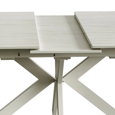 Table Top Close up of Tino Travertine ceramic extending dining table with cream spider metal base