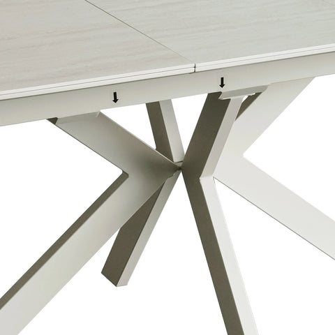 Close up of leg base of Tino Travertine ceramic extending dining table with cream spider metal base