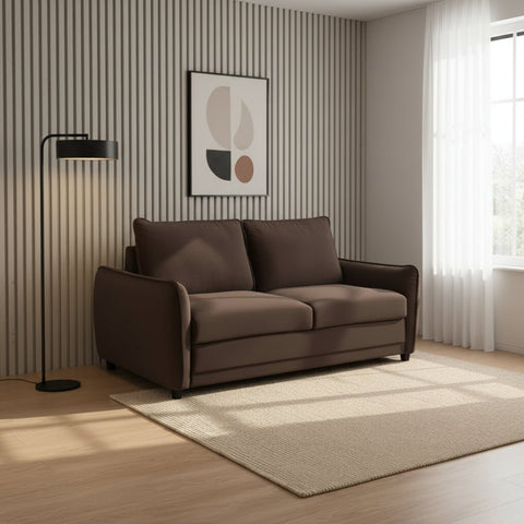 A modern two-seater sofa in dark brown fabric, styled in a contemporary living room with a beige rug, a black floor lamp, a striped accent wall, and a window with sheer white curtains.