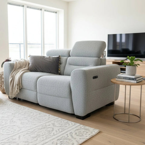 Luxury 2 seater sofa with dual electric reclining seats.