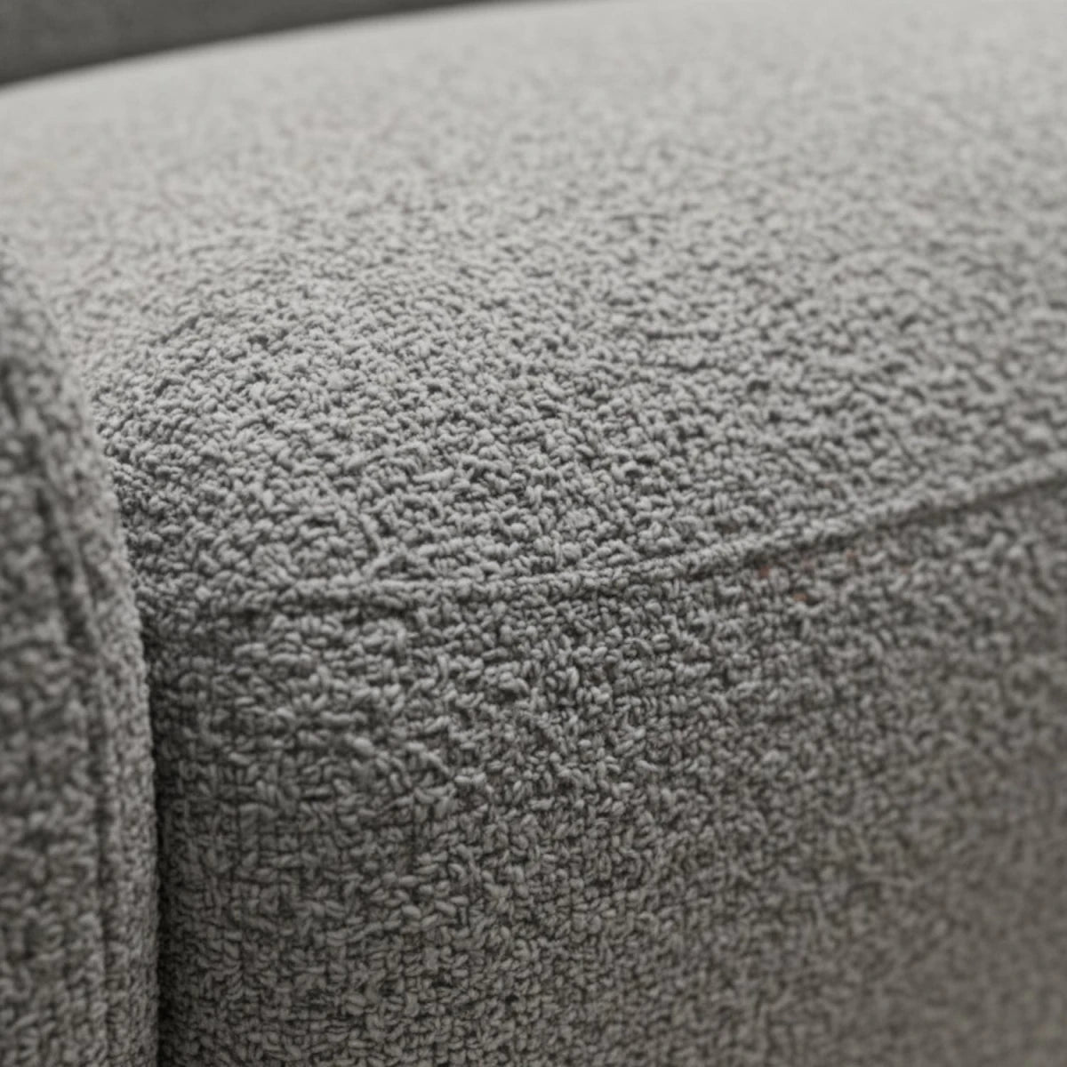 Premium boucle upholstered sofa in neutral grey tone.