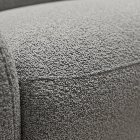 Premium boucle upholstered sofa in neutral grey tone.