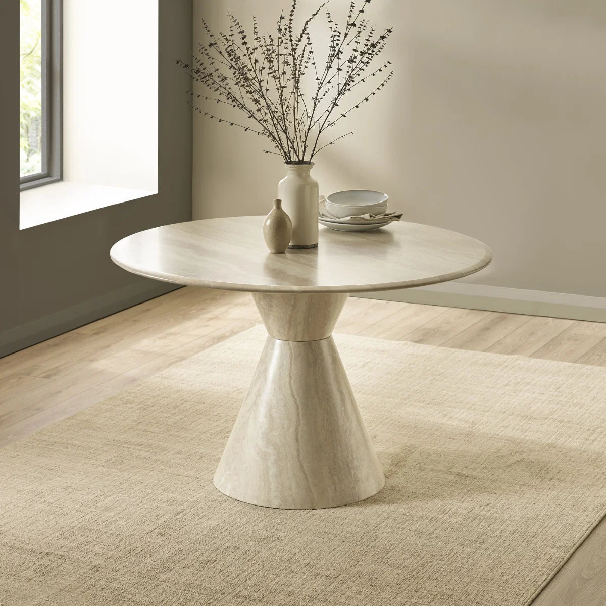 Shop the Vero 120cm Round Cream Marble Effect Dining Table. Featuring a sculptural pedestal base and elegant neutral finish for contemporary dining rooms.
