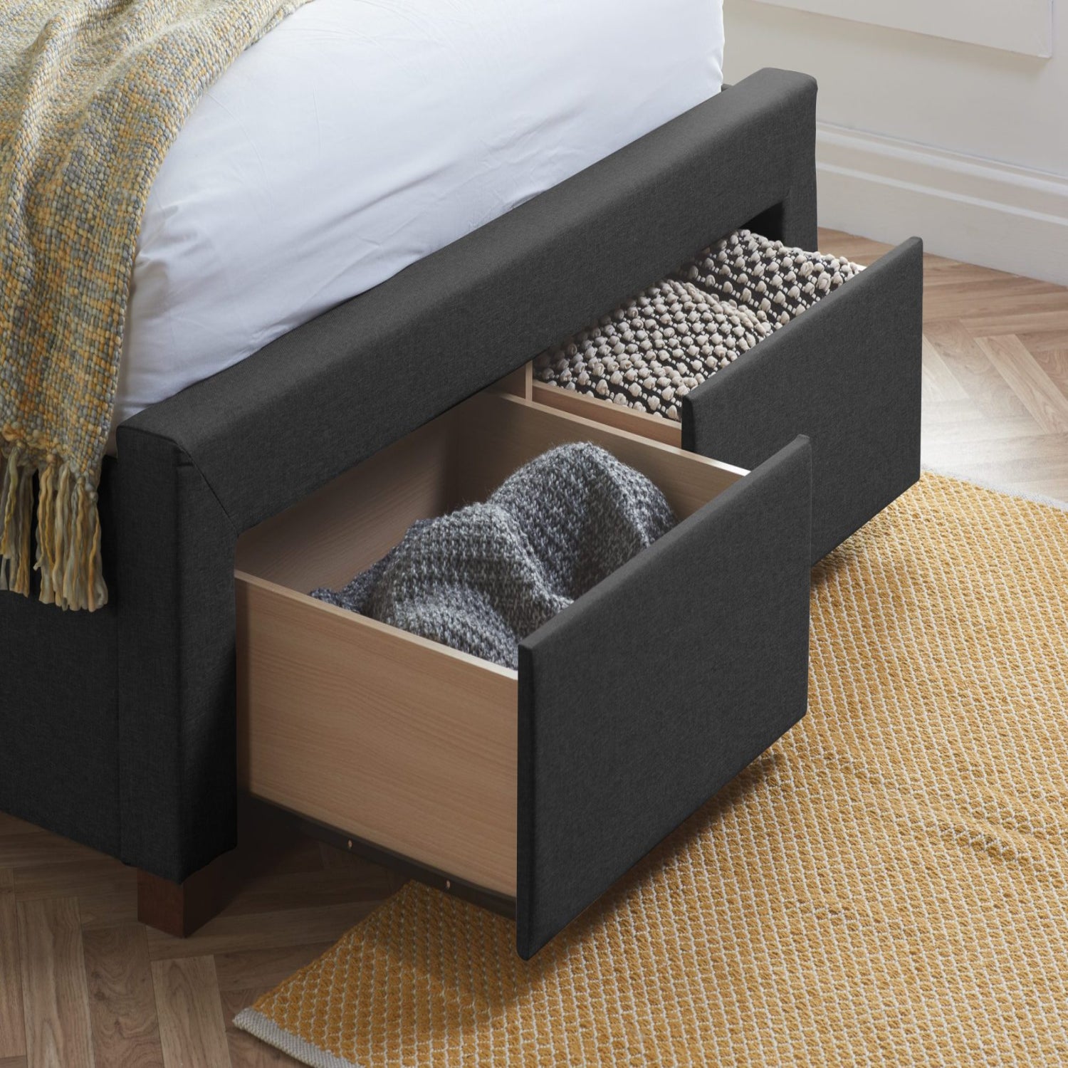 Dual storage drawers built into the foot end for easy access.