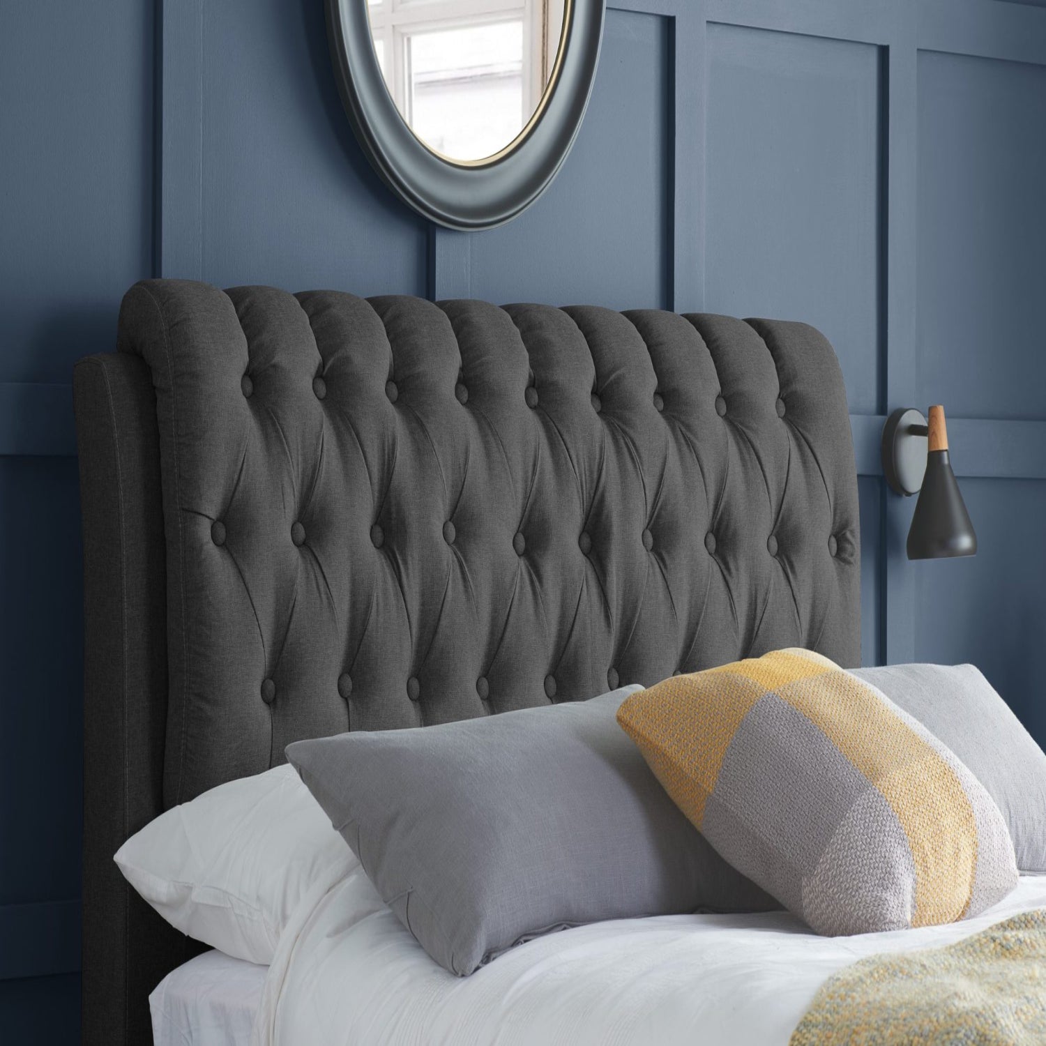 Buttoned upholstered headboard with elegant classic detailing.