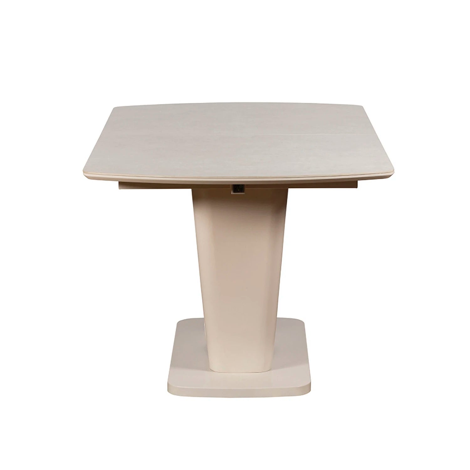 Side view of Cream sintered stone extending dining table with sculptural pedestal base