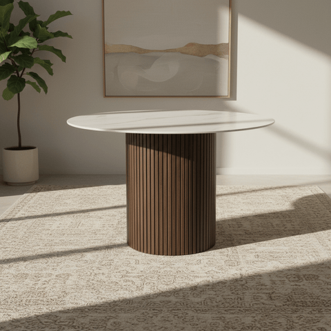 Vigo 120cm round dining table with a white stone-effect top and walnut fluted pedestal base. Contemporary dining table seating up to 4 people.