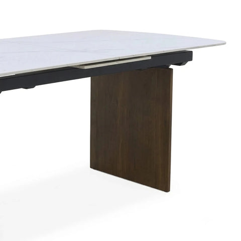 Modern dining table with sculptured walnut pedestal