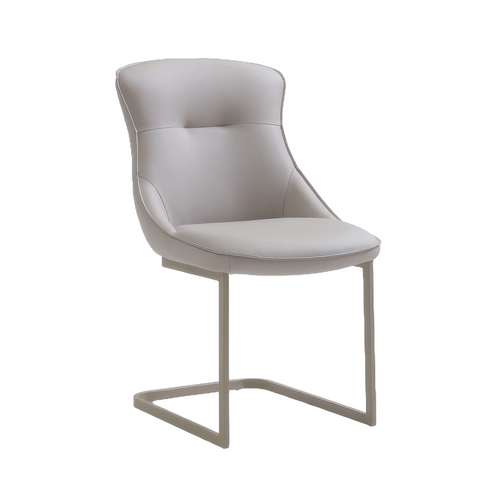 A modern Vita dining chair with a light grey tufted upholstered seat and curved backrest, supported by a sleek cantilevered metal base in a light gray finish, shown against a plain white background.